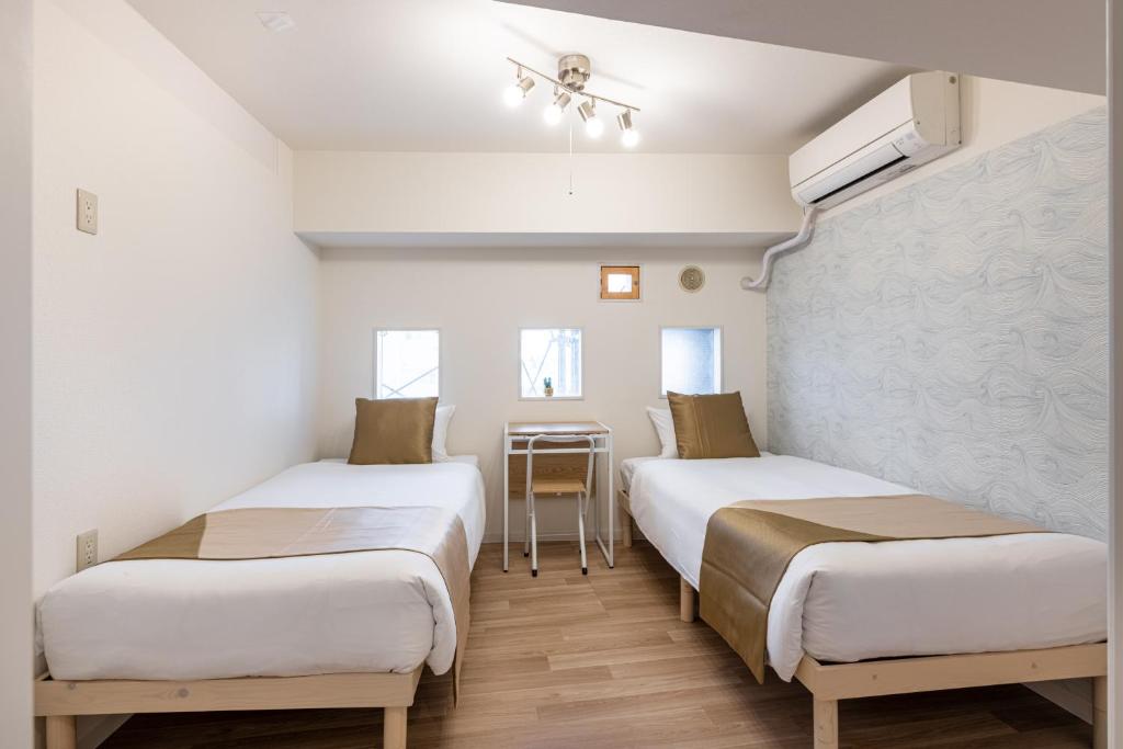 Ένα ή περισσότερα κρεβάτια σε δωμάτιο στο 東新宿 1108