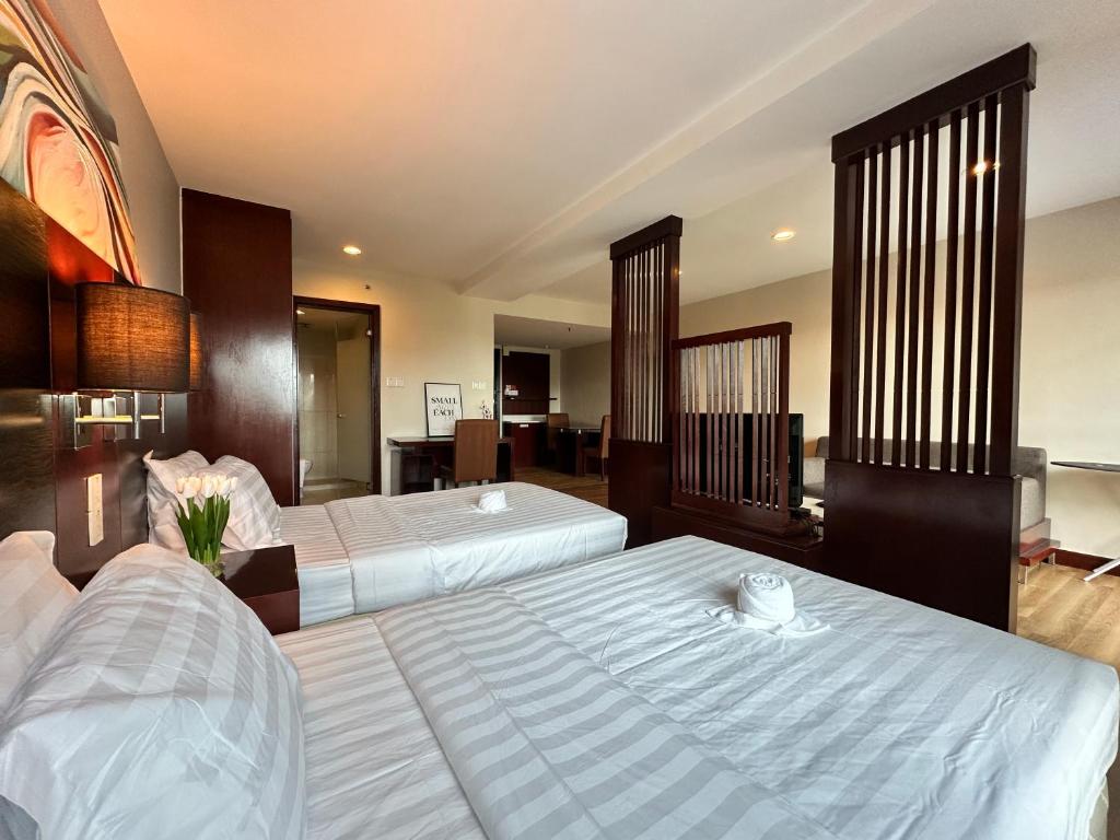Letto o letti in una camera di Ming Greenage Suite 明绿时代套房 @Kota Kinabalu 亚庇市中心
