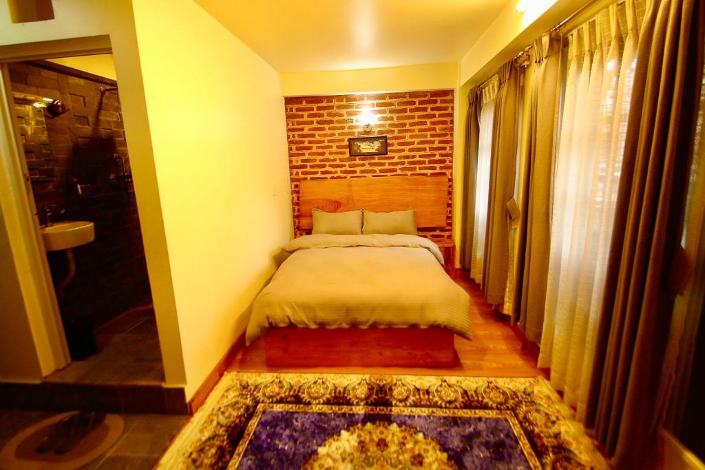 Postel nebo postele na pokoji v ubytování Lumwoh Guest House