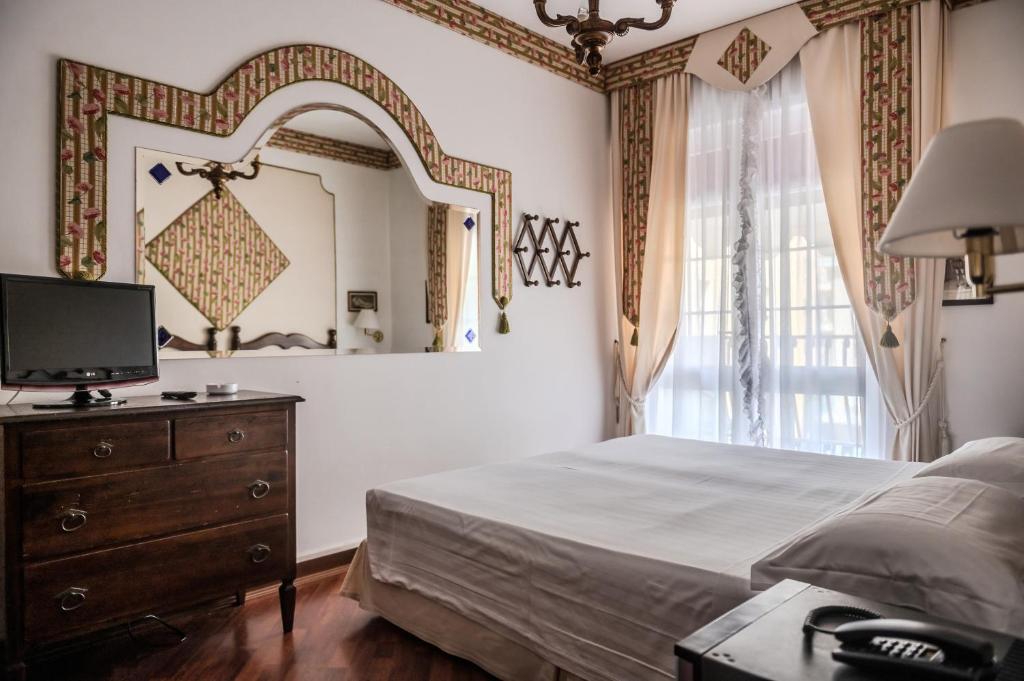 Postel nebo postele na pokoji v ubytování Agora Park Hotel