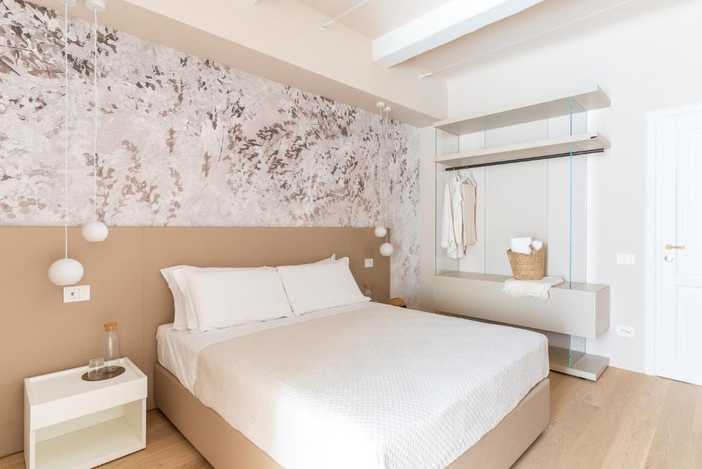 Postel nebo postele na pokoji v ubytování Dimora Bramante Rooms
