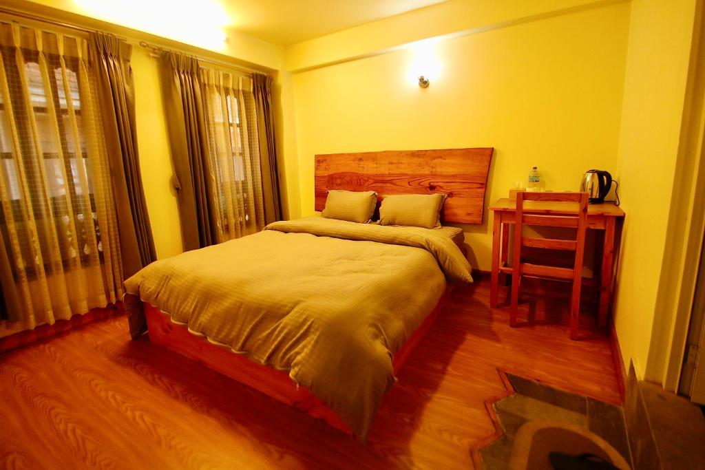 Postel nebo postele na pokoji v ubytování Lumwoh Guest House