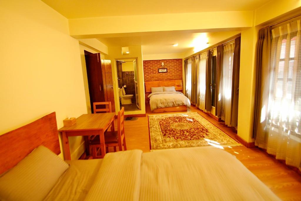 Postel nebo postele na pokoji v ubytování Lumwoh Guest House