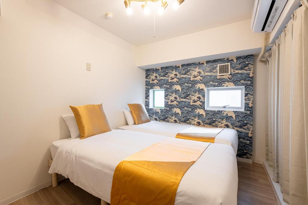 Ένα ή περισσότερα κρεβάτια σε δωμάτιο στο 東新宿 1102