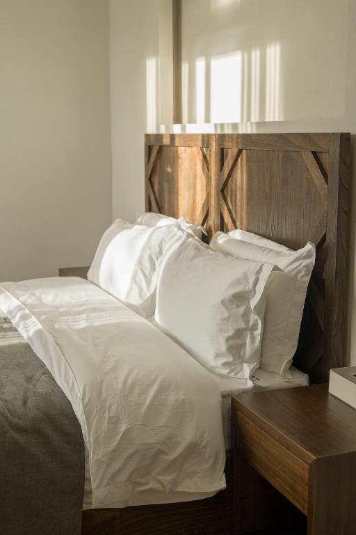 Postel nebo postele na pokoji v ubytování Shan Di B&B