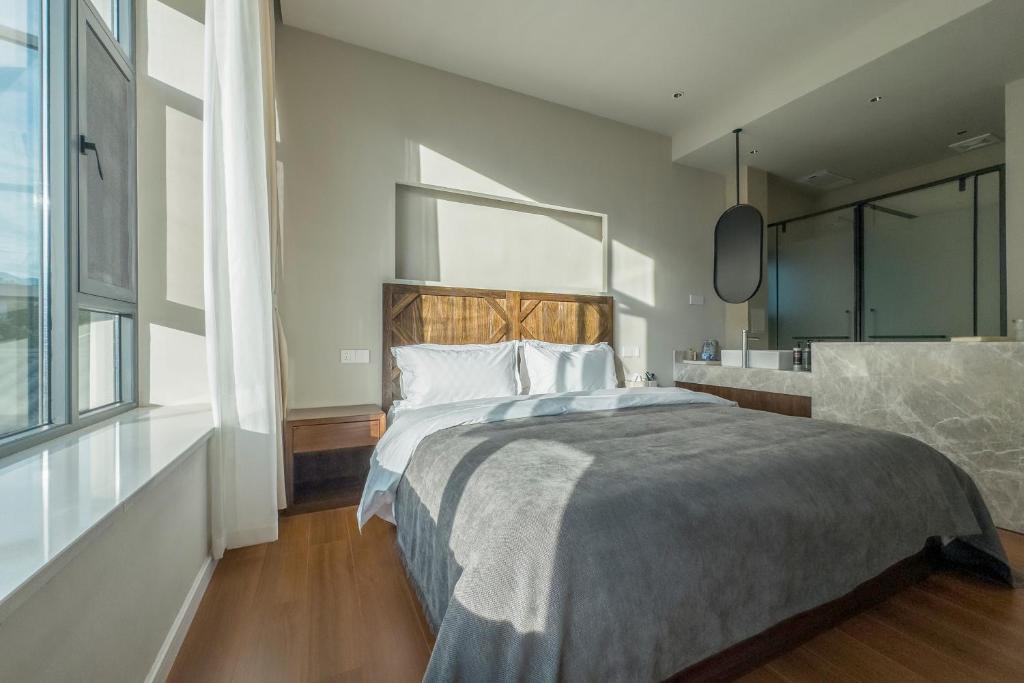 Postel nebo postele na pokoji v ubytování Shan Di B&B