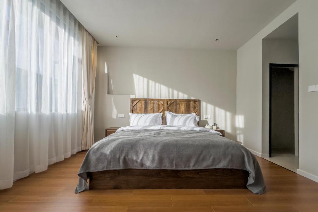 Postel nebo postele na pokoji v ubytování Shan Di B&B