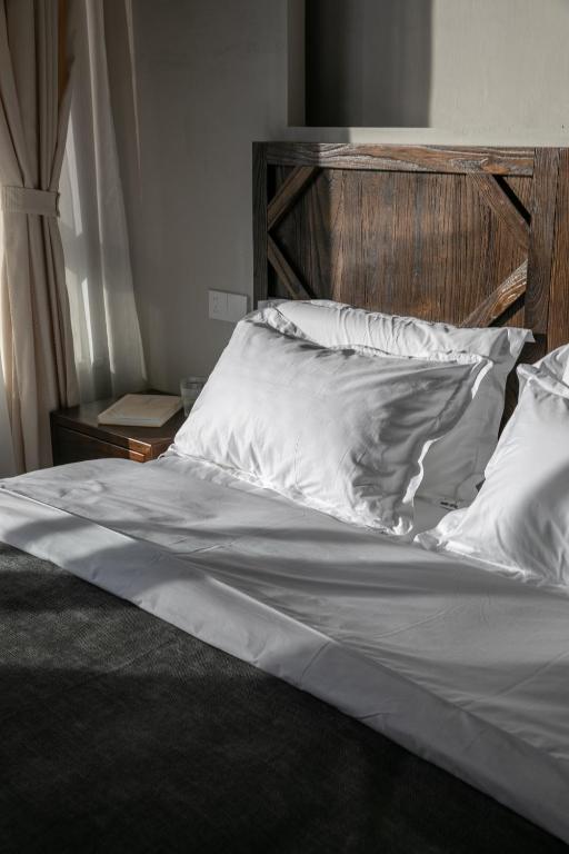 Postel nebo postele na pokoji v ubytování Shan Di B&B
