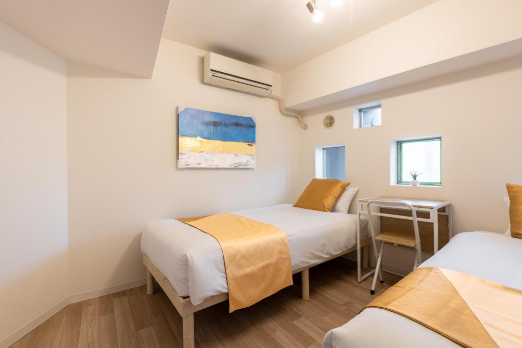 Ένα ή περισσότερα κρεβάτια σε δωμάτιο στο 東新宿 1101