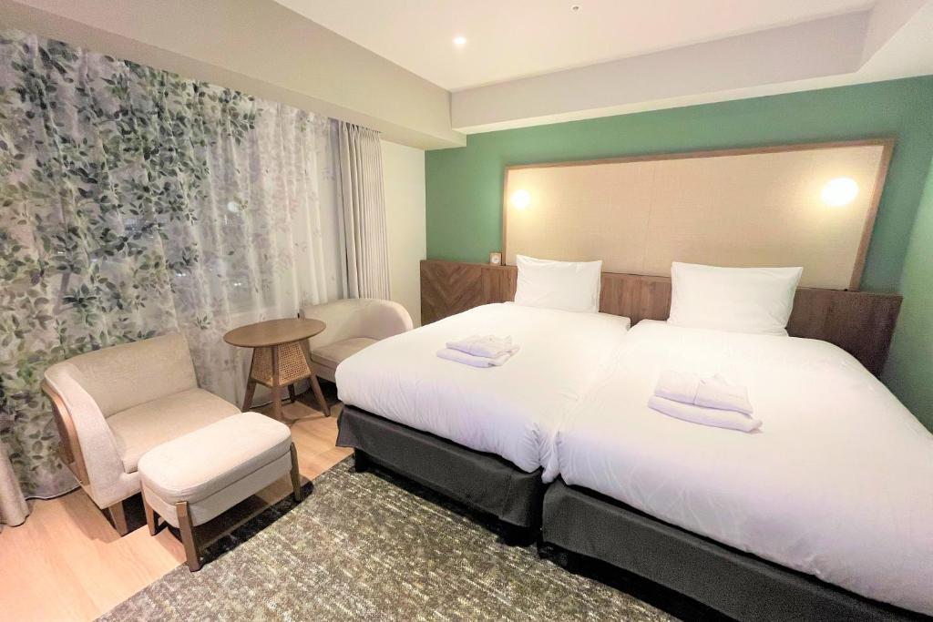 Postel nebo postele na pokoji v ubytování Keisei Richmond Hotel Tokyo Kinshicho