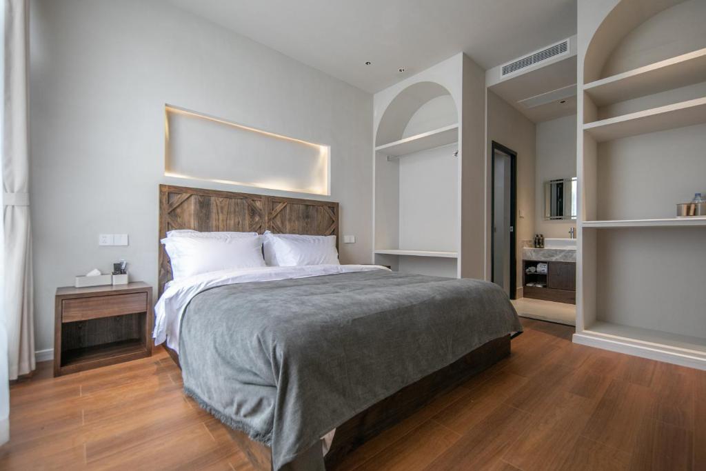 Postel nebo postele na pokoji v ubytování Shan Di B&B