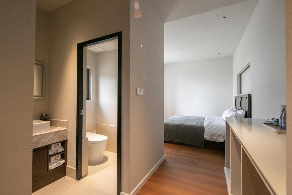 Postel nebo postele na pokoji v ubytování Shan Di B&B