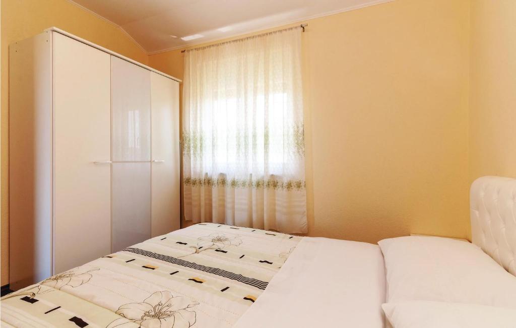 Posteľ alebo postele v izbe v ubytovaní Apartment Ribnica-Krusevo With Sea View Xii