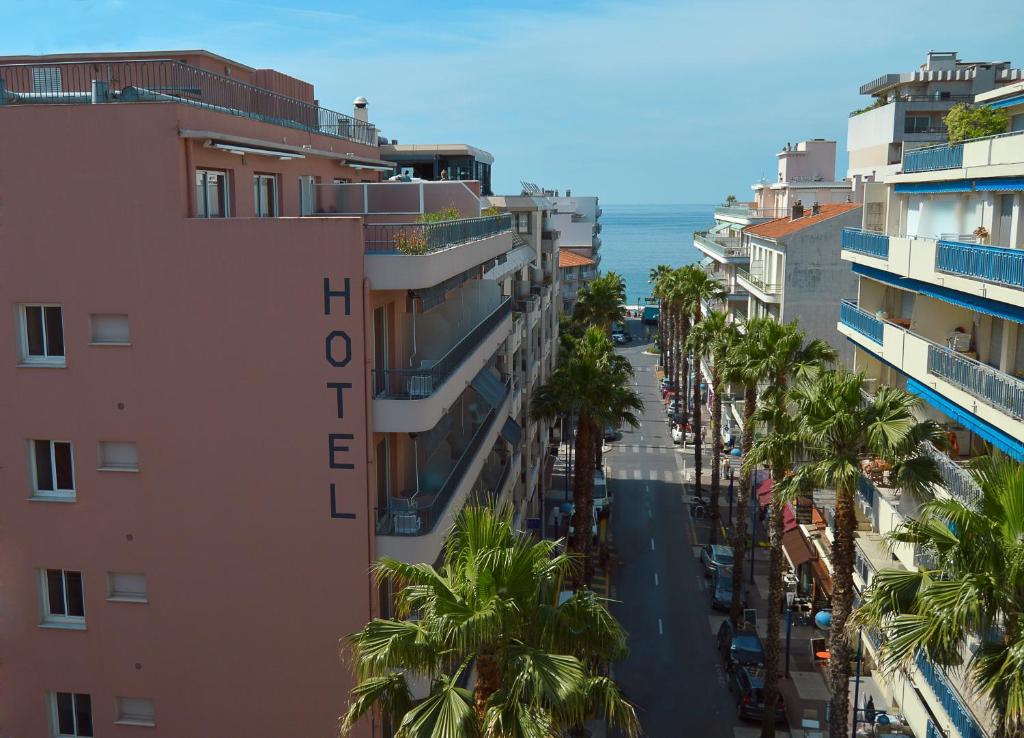 an aerial view of a city street with palm trees at Best Western Astoria in Juan-les-Pins