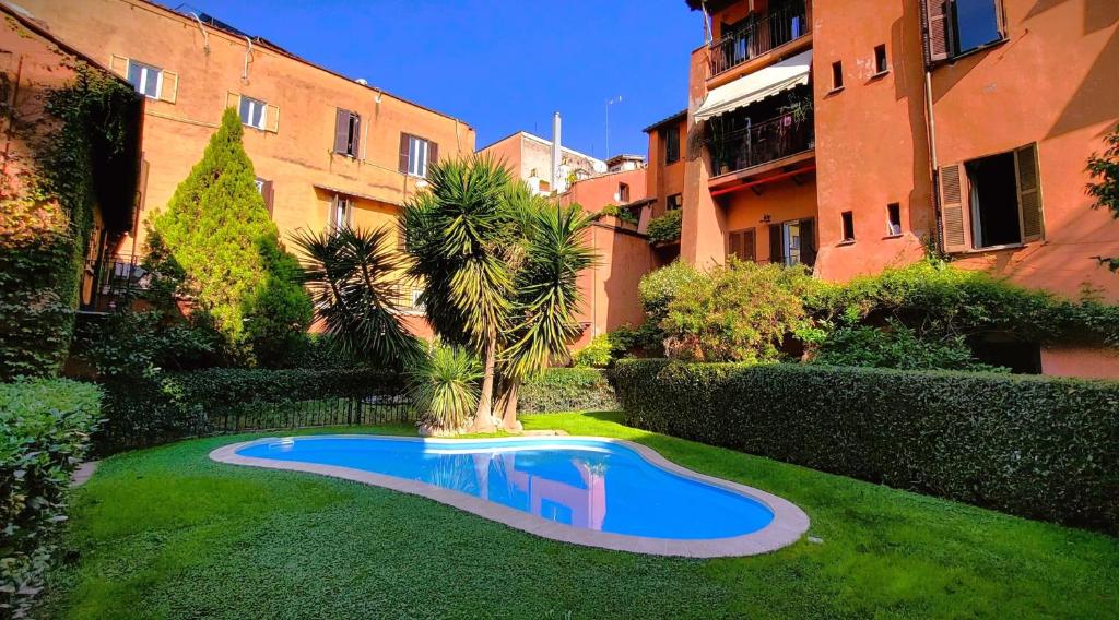 a small swimming pool in the middle of a yard at The Gem - Trastevere Cozy Retreat with pool in Rome