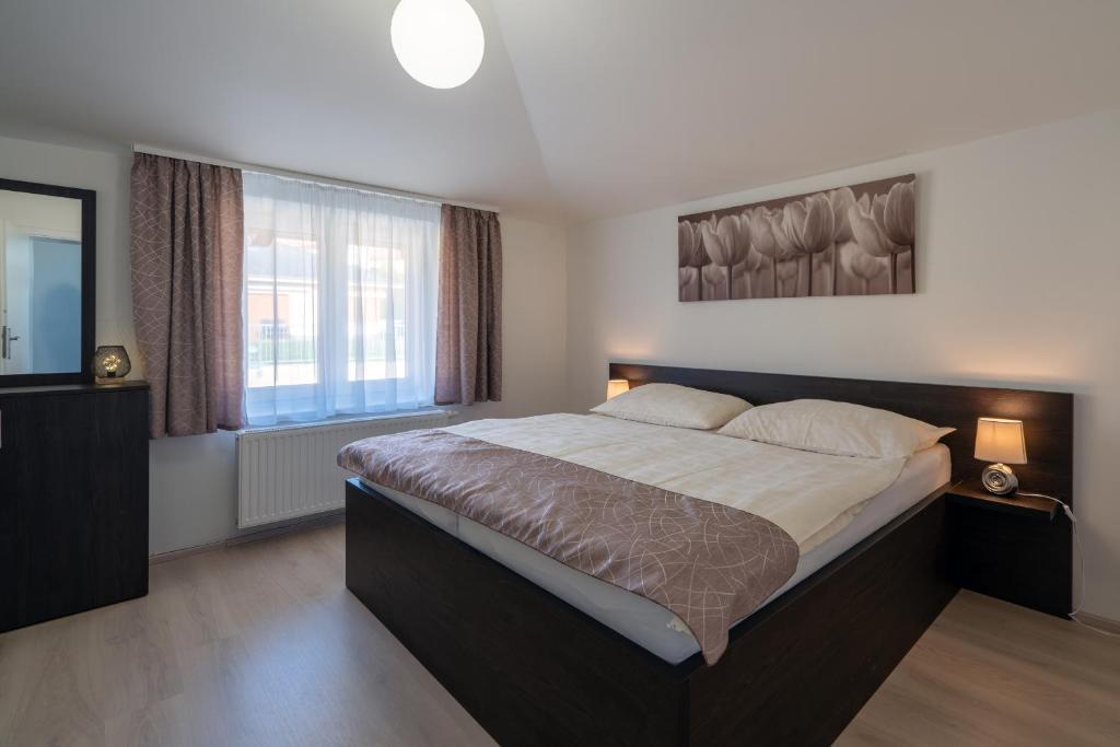 Postel nebo postele na pokoji v ubytování Rezidence Sunny Hill