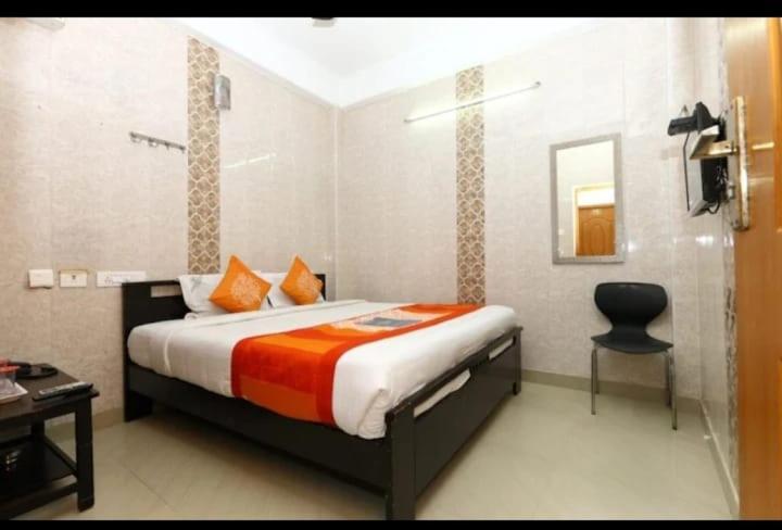 Giường trong phòng chung tại SMS GRAND inn