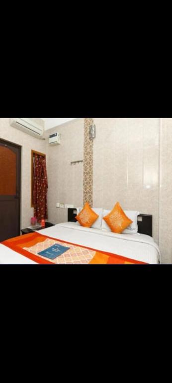 Giường trong phòng chung tại SMS GRAND inn