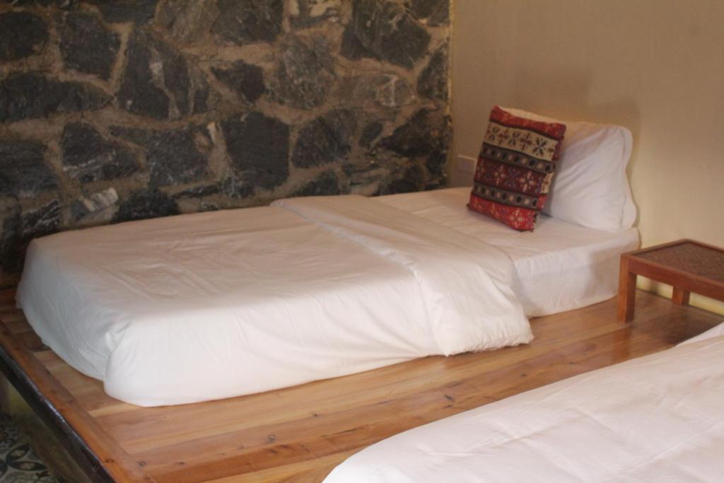 Giường trong phòng chung tại Ha Giang Ecolodge