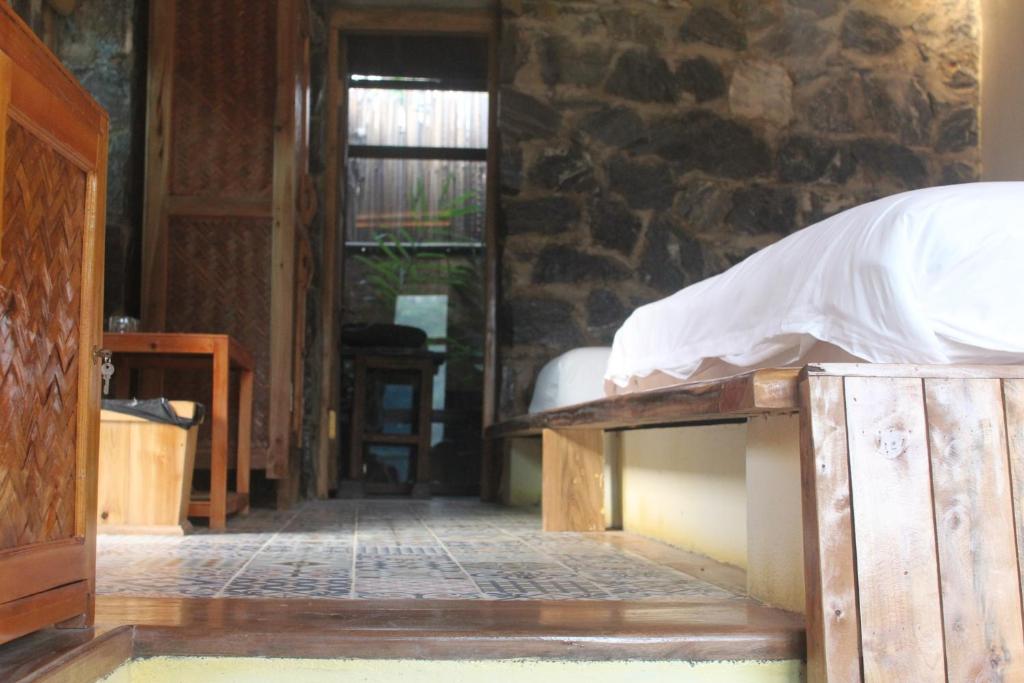 Giường trong phòng chung tại Ha Giang Ecolodge