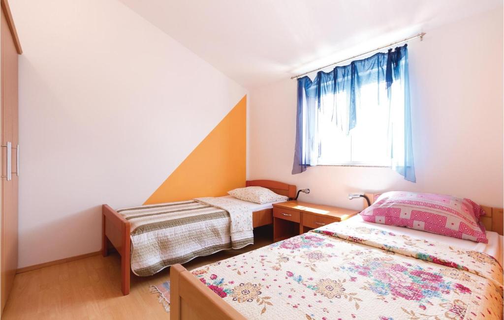Łóżko lub łóżka w pokoju w obiekcie Holiday Home Betiga Betiga Ii