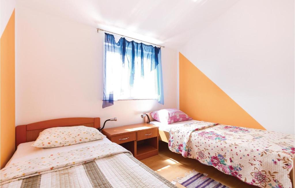 Łóżko lub łóżka w pokoju w obiekcie Holiday Home Betiga Betiga Ii