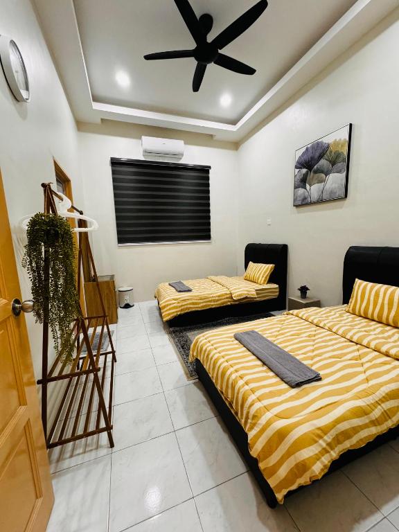 Postel nebo postele na pokoji v ubytování Mia homestay