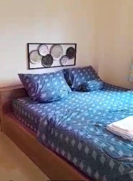 Postel nebo postele na pokoji v ubytování ขุนโลหะ