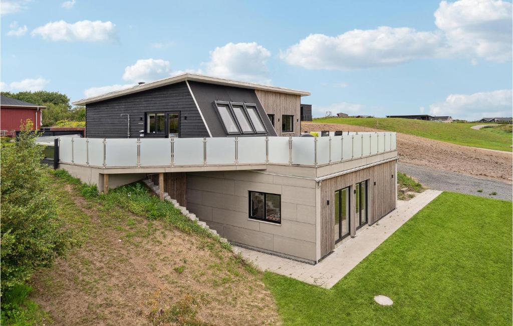 a house on the side of a hill at Beautiful Home In Spøttrup With Wifi in Lihme