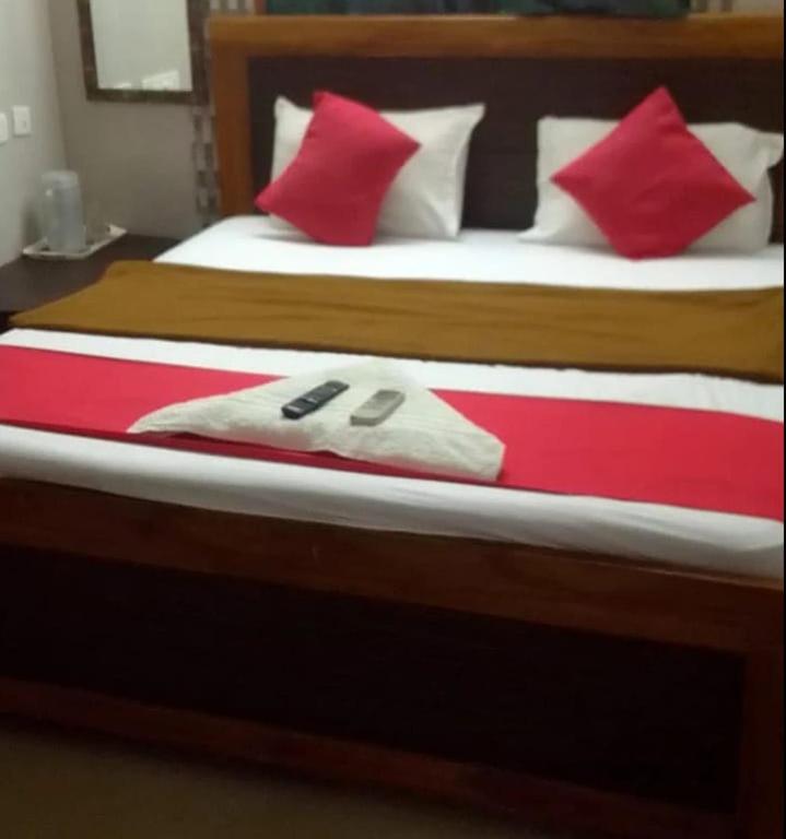 Giường trong phòng chung tại SMS GRAND inn