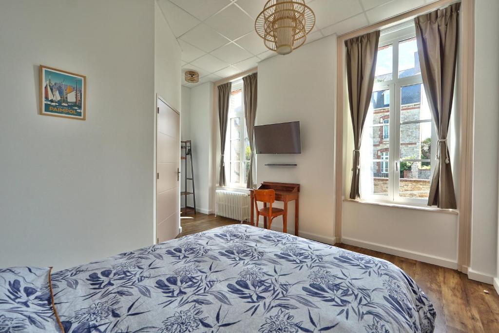 Postel nebo postele na pokoji v ubytování Auberge Ti'gousket
