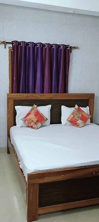 Giường trong phòng chung tại SMS GRAND inn