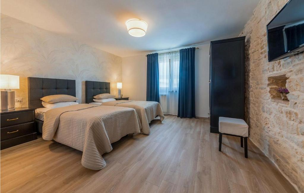 Łóżko lub łóżka w pokoju w obiekcie Villa Gambin