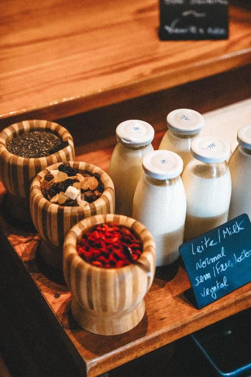 a group of jars and bowls of spices on a shelf at Aldeia da Cuada in Faja Grande