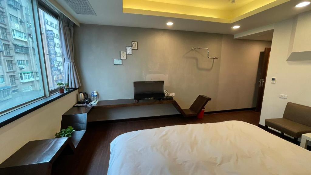 Postel nebo postele na pokoji v ubytování Kaili Hot Spring Hotel