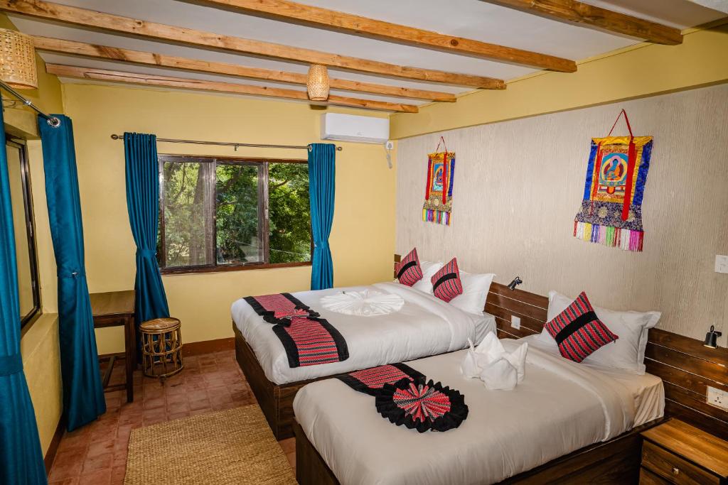 Postel nebo postele na pokoji v ubytování Thamel Heritage Hostel