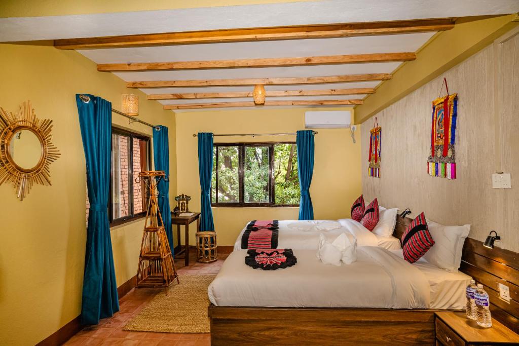 Postel nebo postele na pokoji v ubytování Thamel Heritage Hostel