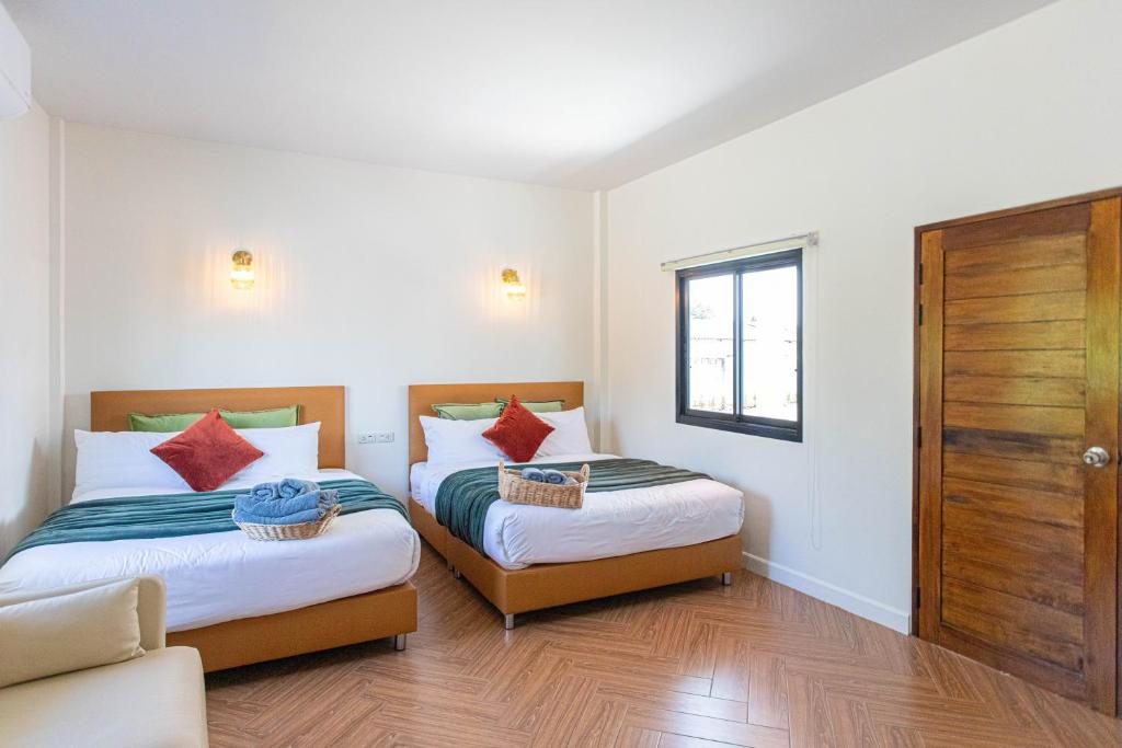 Postel nebo postele na pokoji v ubytování Vawa Guesthouse