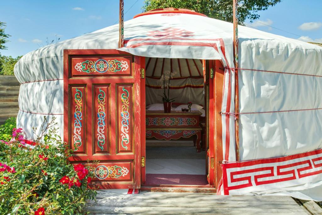 an open door to a room in a yurt at Home Paradis & Spa - Ecolodge in Souvigné