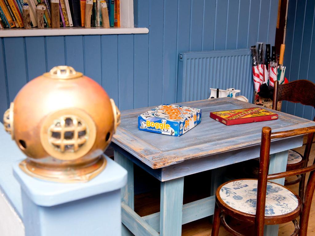 a table with a cake on top of it at YHA Boggle Hole in Fylingthorpe