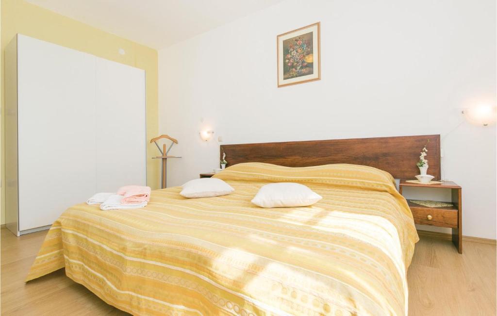 Łóżko lub łóżka w pokoju w obiekcie Apartment Labin Kapelica Iii