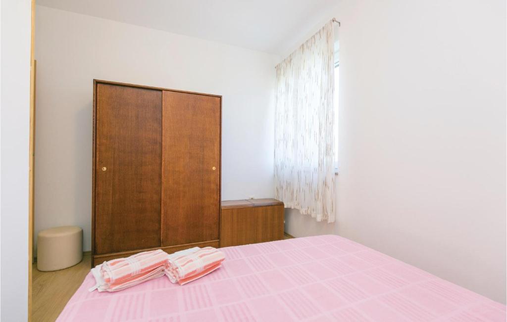 Łóżko lub łóżka w pokoju w obiekcie Apartment Labin Kapelica Iii