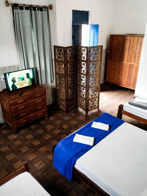 Postel nebo postele na pokoji v ubytování Pousada e Hostel Andarai