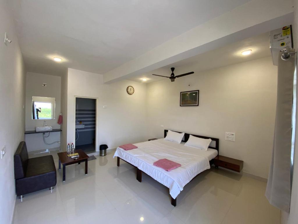Ένα ή περισσότερα κρεβάτια σε δωμάτιο στο Blackbuck Homestay