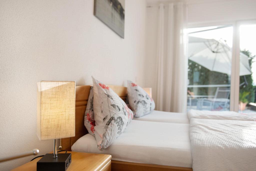 Postel nebo postele na pokoji v ubytování Pension Zum Talhof