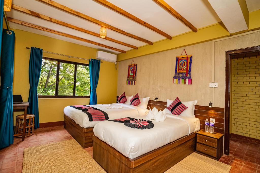 Postel nebo postele na pokoji v ubytování Thamel Heritage Hostel