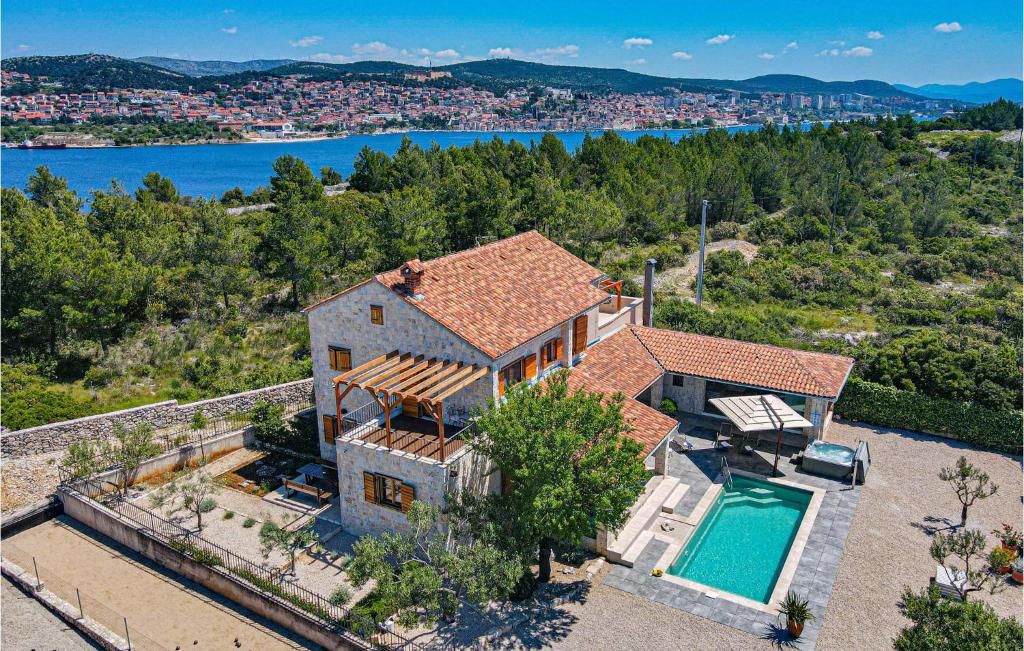 an aerial view of a house with a swimming pool at Lovely Home In Jadrija With Wifi in Jadrija
