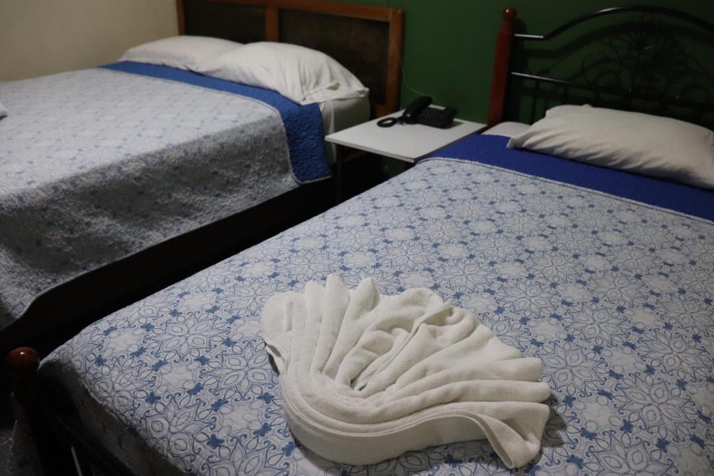 Postel nebo postele na pokoji v ubytování Hotel Toledo