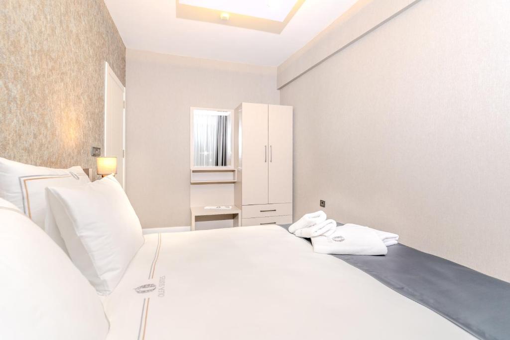 Postel nebo postele na pokoji v ubytování Olea Suites Otel