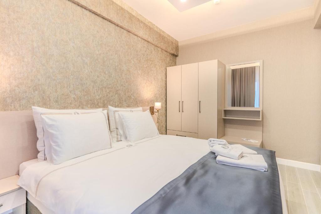 Postel nebo postele na pokoji v ubytování Olea Suites Otel